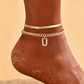 💛 Nőknek készült finom réteges arany monogramos bokakarkötő – Elegáns, divatos – Utánvét ✨